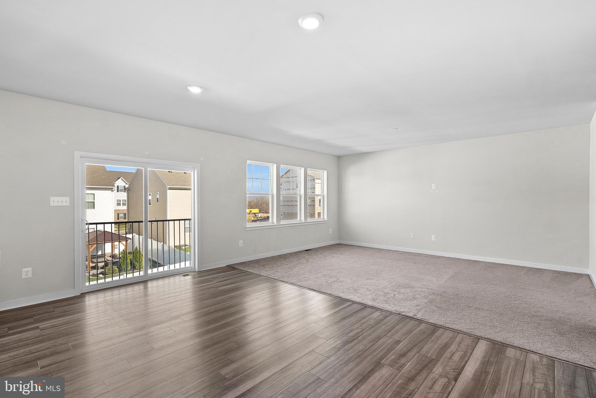 261 Short Br Drive Ranson, WV 25438 - Photo 28 of 71 an empty room with wooden floor and windows
