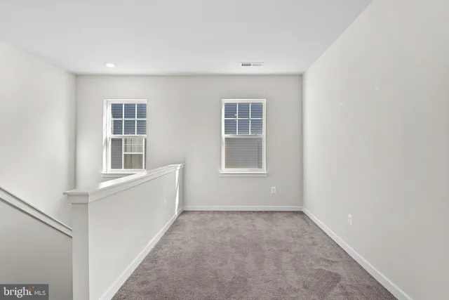 a spacious bathroom with a shower sink and mirror