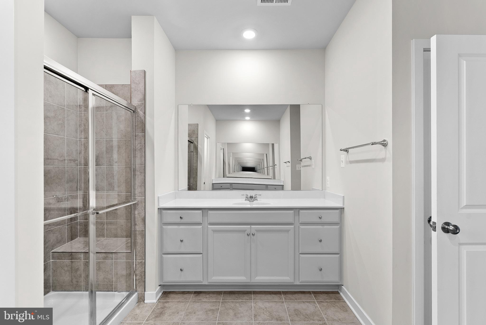 261 Short Br Drive Ranson, WV 25438 - Photo 36 of 71 a bathroom with a double vanity sink and mirror