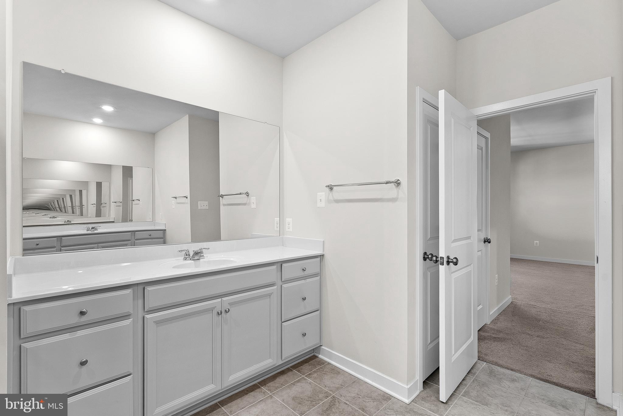 261 Short Br Drive Ranson, WV 25438 - Photo 37 of 71 a en suite bathroom with a granite countertop sink mirror and