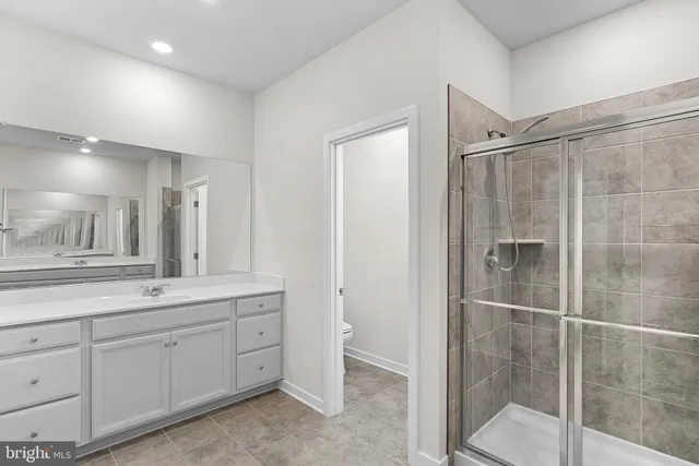a bathroom with a bathtub and shower
