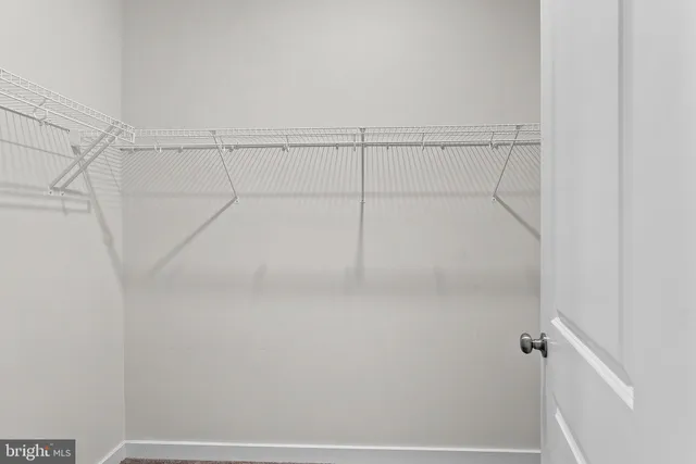 an empty room with white walls
