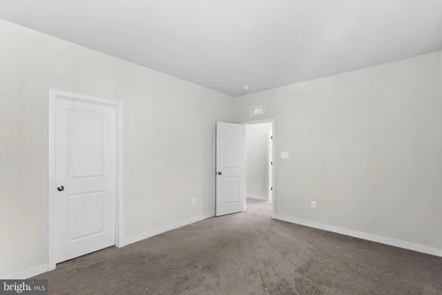 a view of swimming pool with outdoor seating and a garden