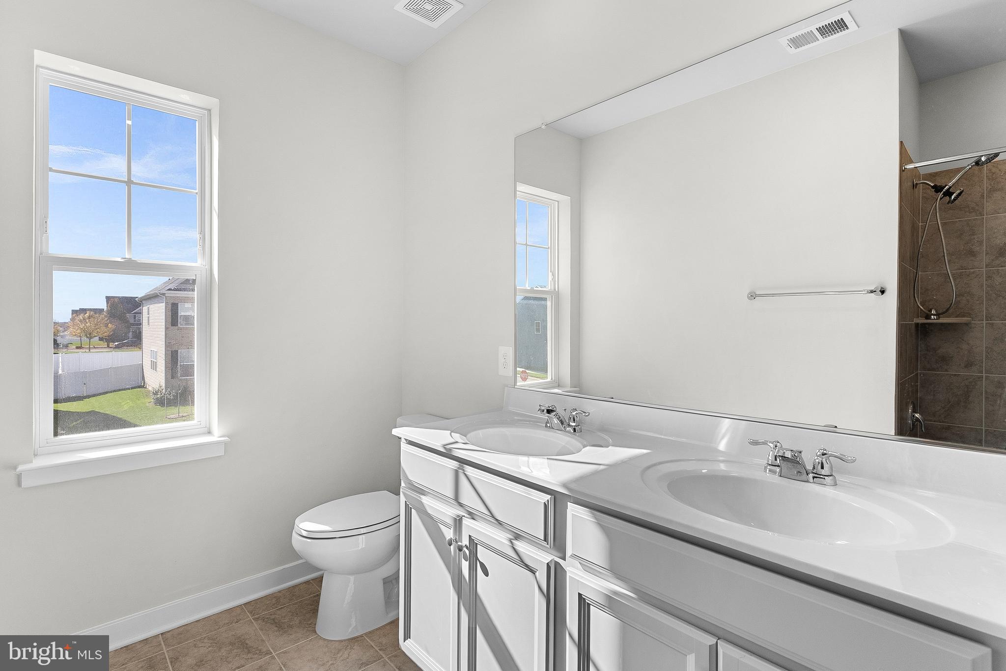 261 Short Br Drive Ranson, WV 25438 - Photo 51 of 71 a bathroom with a double vanity sink toilet and a mirror