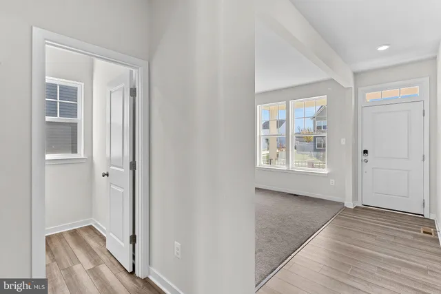 a view of livingroom with hardwood floor and hallway