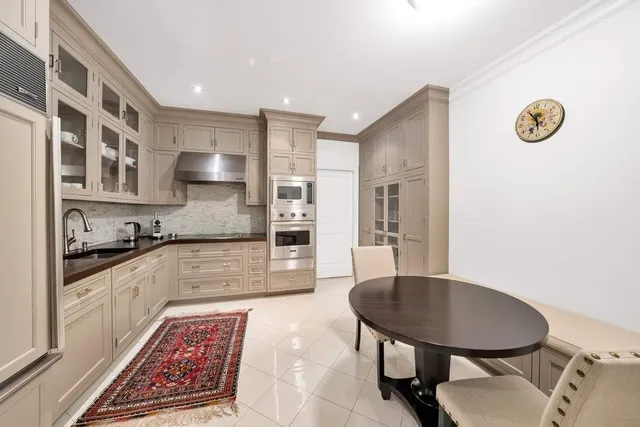 a kitchen with stainless steel appliances granite countertop a sink and cabinets