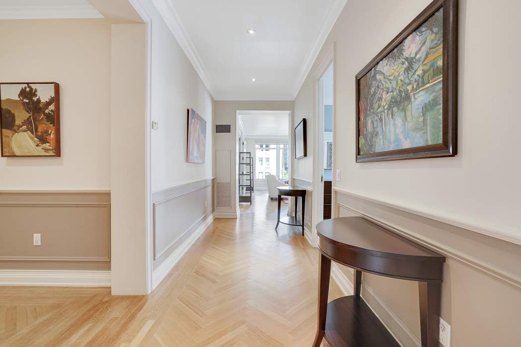 515 Park Avenue, Unit 5A Manhattan, NY 10022 - Photo 5 of 19 a dining room with furniture and window