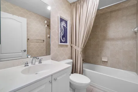 a bathroom with a sink a toilet and a bathtub