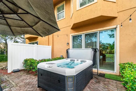 a backyard of a house with yard barbeque oven and outdoor seating