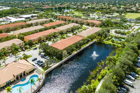 an aerial view of residential house with outdoor space and swimming pool
