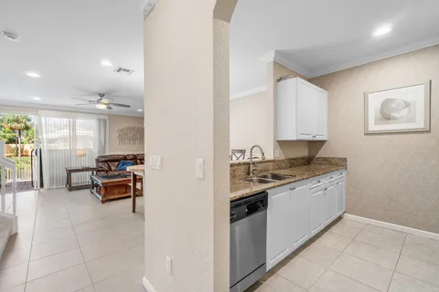 a kitchen with stainless steel appliances granite countertop a stove and a sink