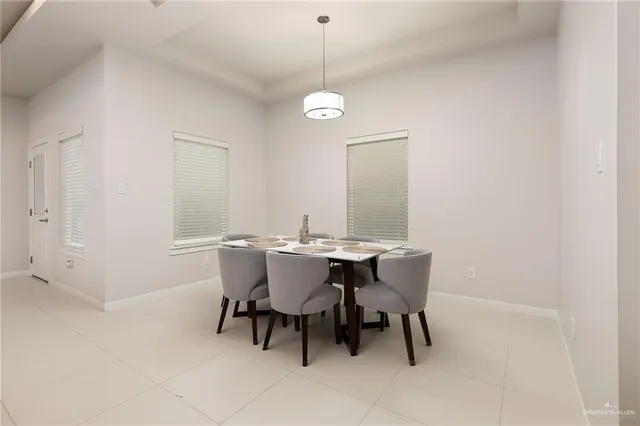 a view of a dining room with furniture and window
