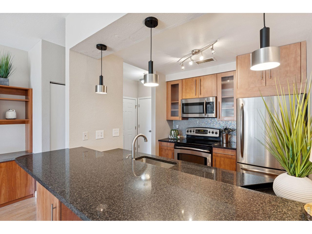 3260 47th Street, Unit 108A Boulder, CO 80301 - Photo 7 of 25 Room for bar stools on your kitchen island!