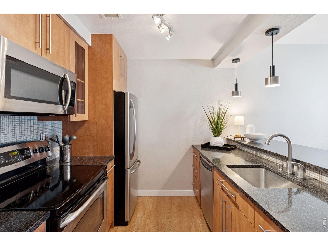 3260 47th Street, Unit 108A Boulder, CO 80301 - Photo 8 of 25 Stainless steel appliances and solid surface counters to make meal prep and clean up a breeze.