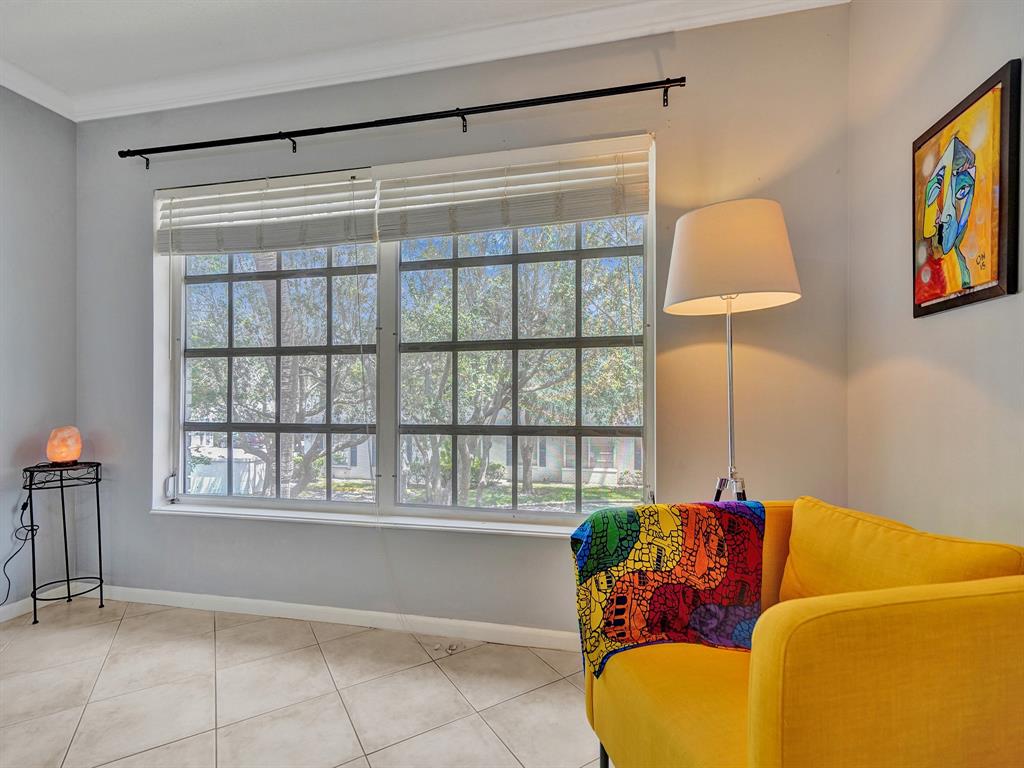 2250 Northeast 66th Street, Unit 1523 Fort Lauderdale, FL 33308 - Photo 17 of 30 a living room with furniture and a window