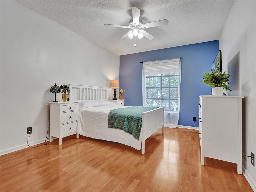 2250 Northeast 66th Street, Unit 1523 Fort Lauderdale, FL 33308 - Photo 2 of 30 a bedroom with a bed and a window