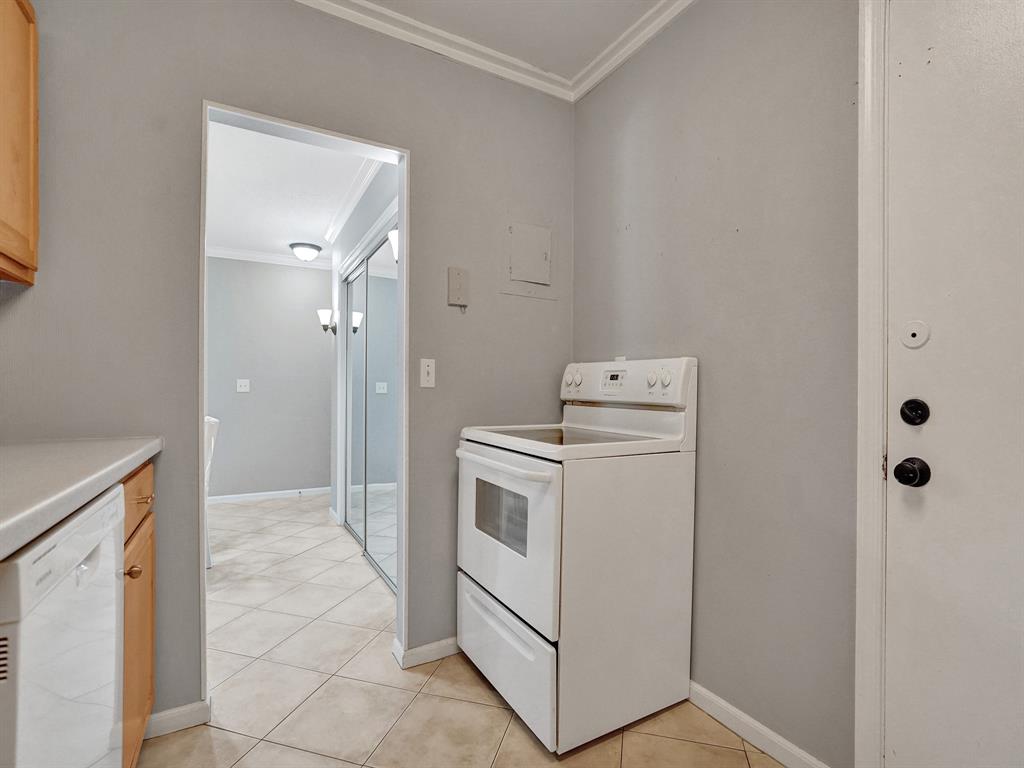 2250 Northeast 66th Street, Unit 1523 Fort Lauderdale, FL 33308 - Photo 26 of 30 a view of a storage & utility room with washer and dryer