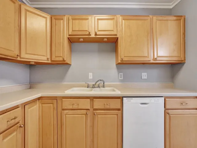a kitchen with granite countertop cabinets and a sink