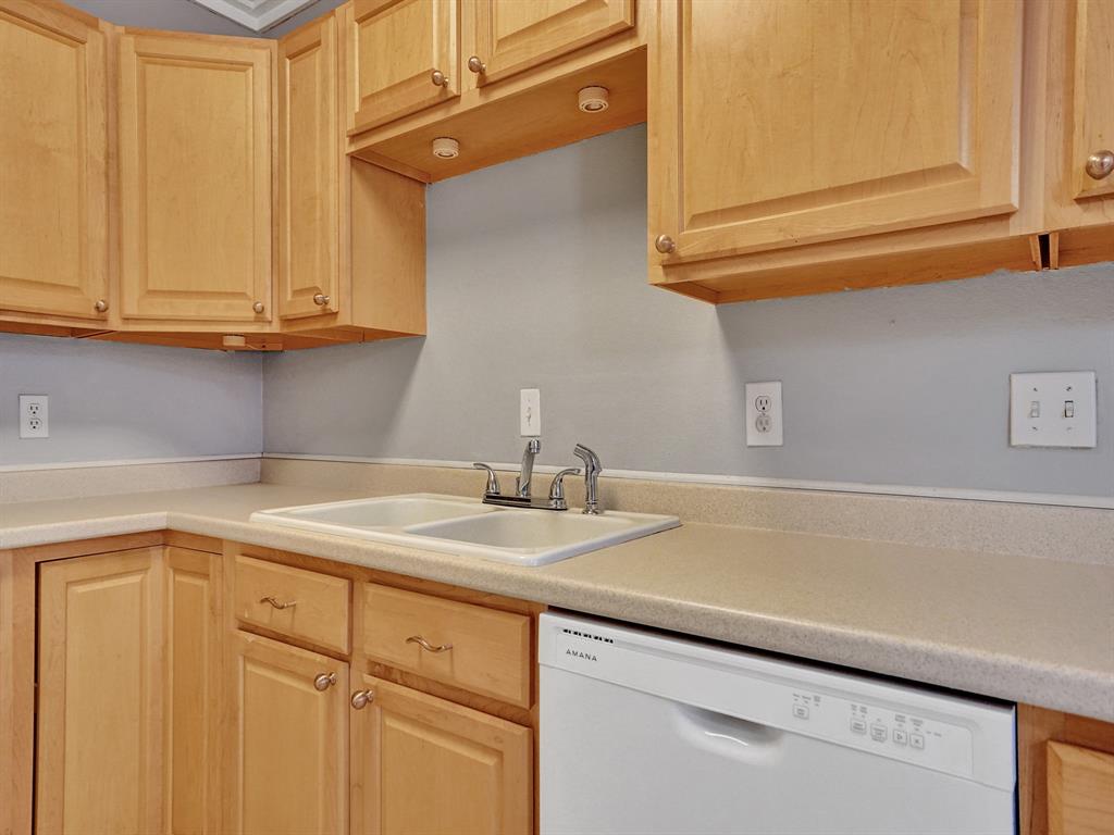 2250 Northeast 66th Street, Unit 1523 Fort Lauderdale, FL 33308 - Photo 28 of 30 a bathroom with a sink and cabinets