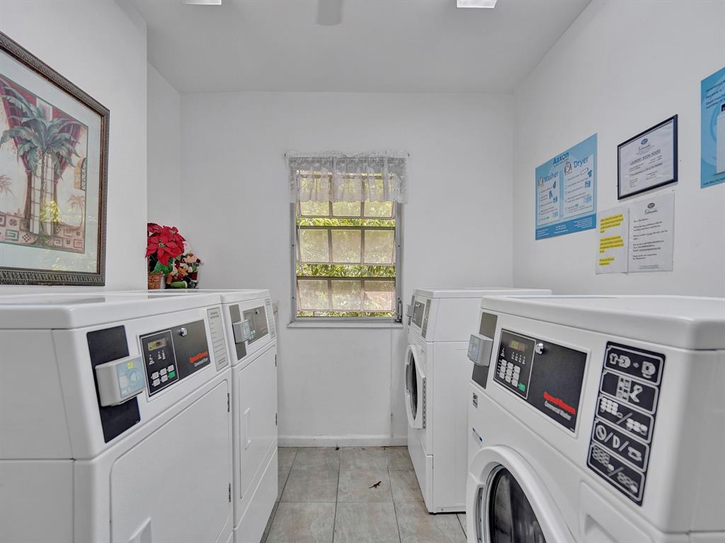 2250 Northeast 66th Street, Unit 1523 Fort Lauderdale, FL 33308 - Photo 29 of 30 a utility room with dryer and washer