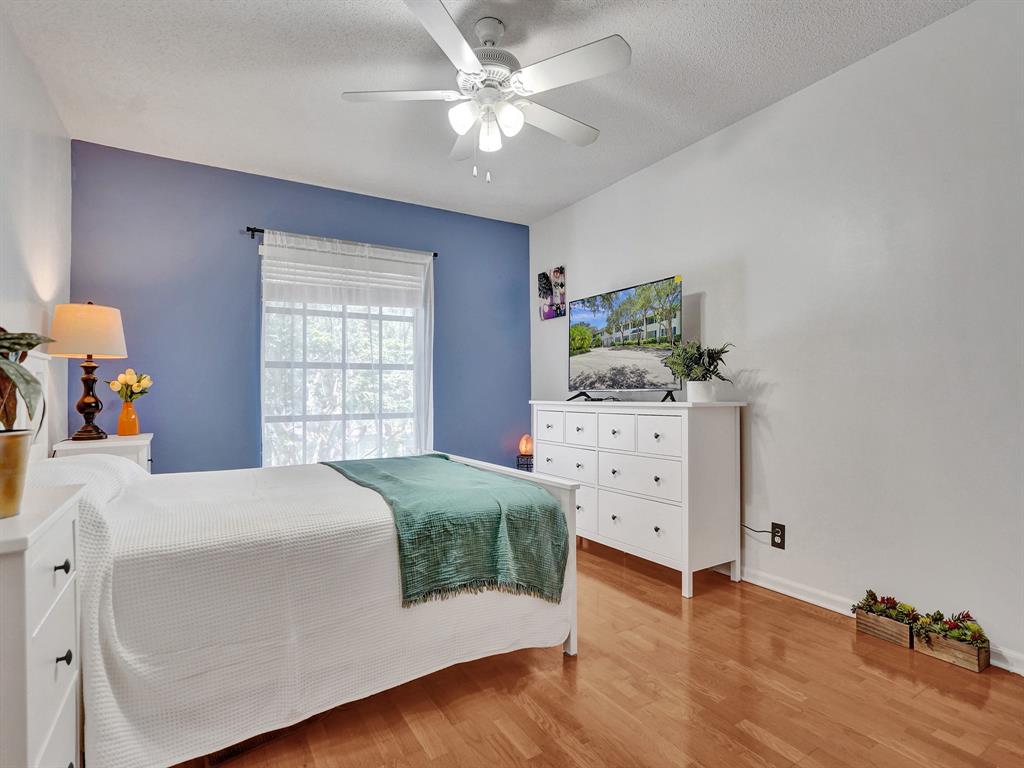 2250 Northeast 66th Street, Unit 1523 Fort Lauderdale, FL 33308 - Photo 3 of 30 a bedroom with a bed and a dresser