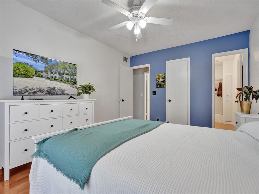 2250 Northeast 66th Street, Unit 1523 Fort Lauderdale, FL 33308 - Photo 5 of 30 a bedroom with a bed and a dresser