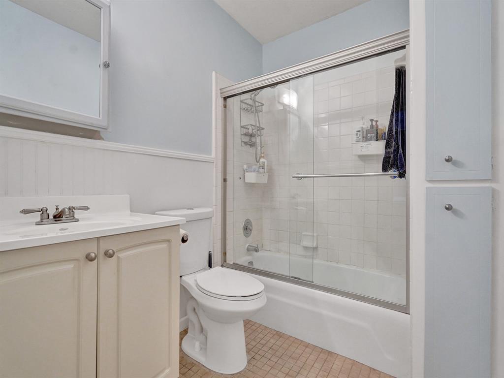 2250 Northeast 66th Street, Unit 1523 Fort Lauderdale, FL 33308 - Photo 6 of 30 a bathroom with a shower a toilet and a sink