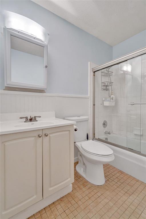 2250 Northeast 66th Street, Unit 1523 Fort Lauderdale, FL 33308 - Photo 7 of 30 a bathroom with a sink a toilet and a mirror
