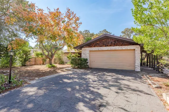 a front view of a house with a garage