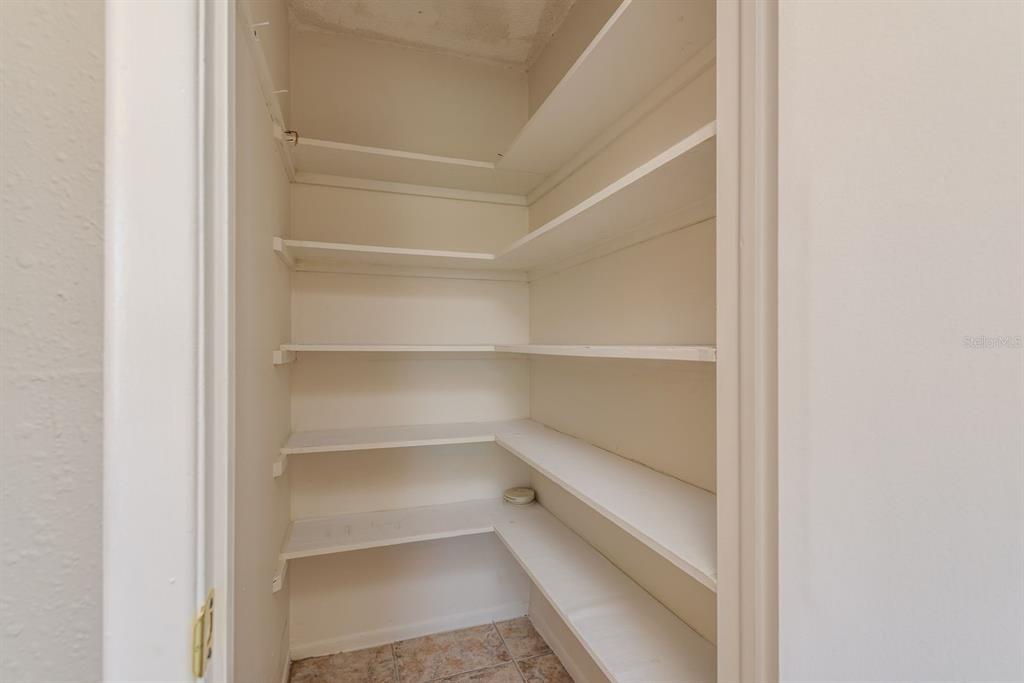 1104 Carlton Road Tarpon Springs, FL 34689 - Photo 28 of 35 a view of a room with shelf