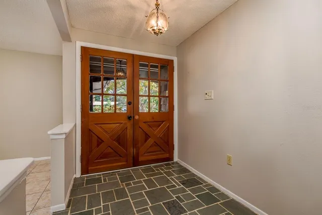 a view of an empty room with windows