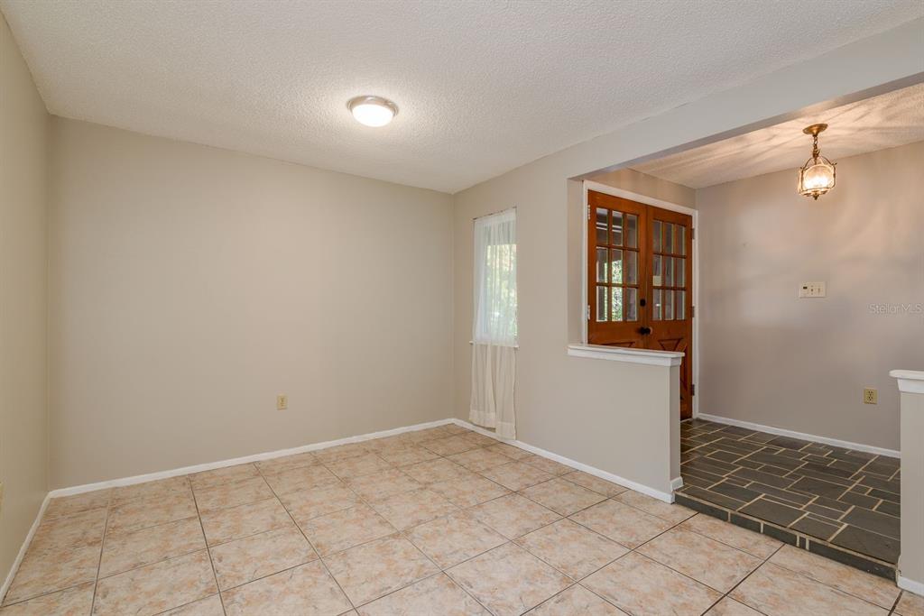 1104 Carlton Road Tarpon Springs, FL 34689 - Photo 8 of 35 an empty room with windows