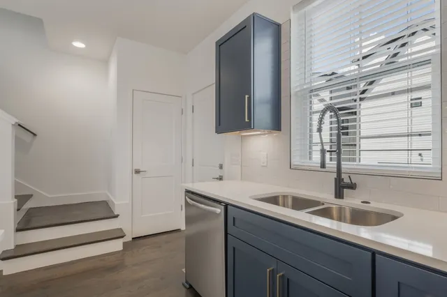a kitchen with a sink and cabinets