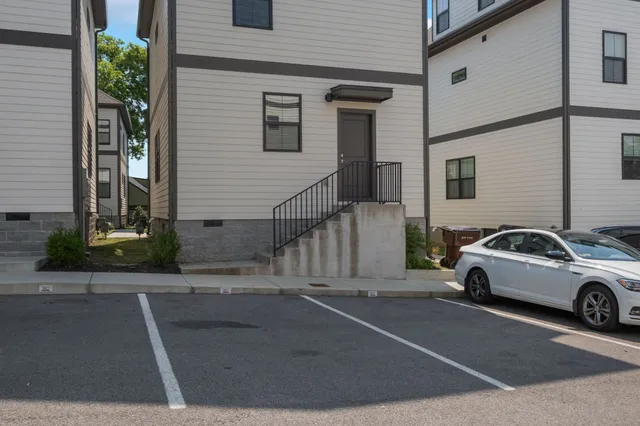 a view of a cars parked in front of a house