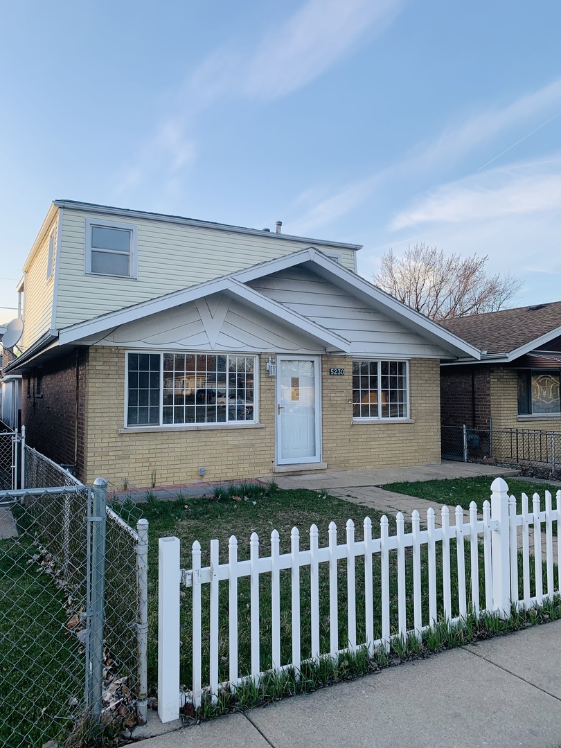 5230 State Road Burbank, IL 60459 - Photo 2 of 26 a front view of a house having yard