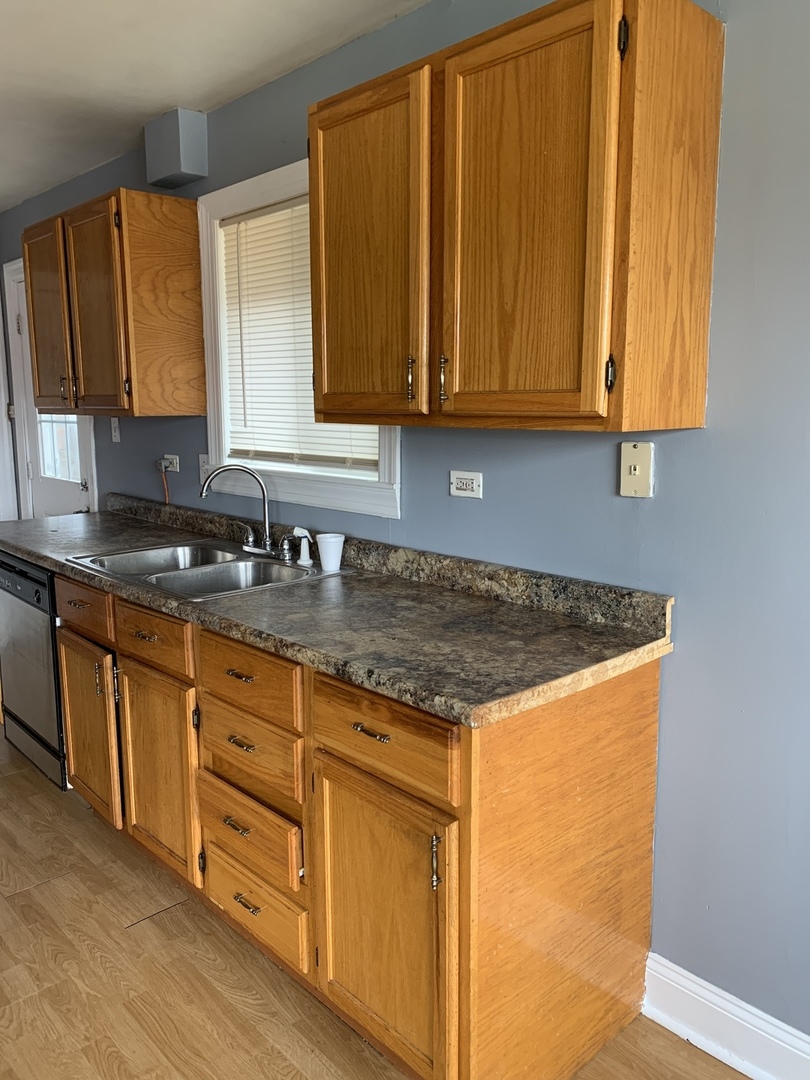5230 State Road Burbank, IL 60459 - Photo 26 of 26 a kitchen with stainless steel appliances granite countertop cabinets and a counter top space
