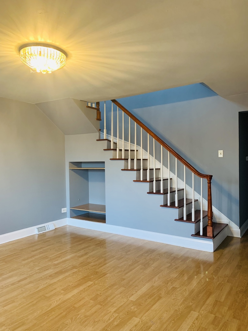 5230 State Road Burbank, IL 60459 - Photo 8 of 26 a view of an empty room with stairs