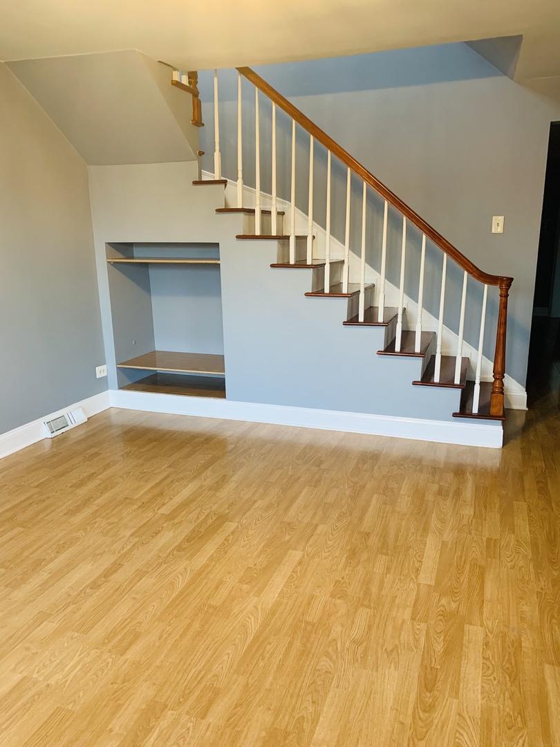 5230 State Road Burbank, IL 60459 - Photo 9 of 26 a view of an entryway with wooden floor