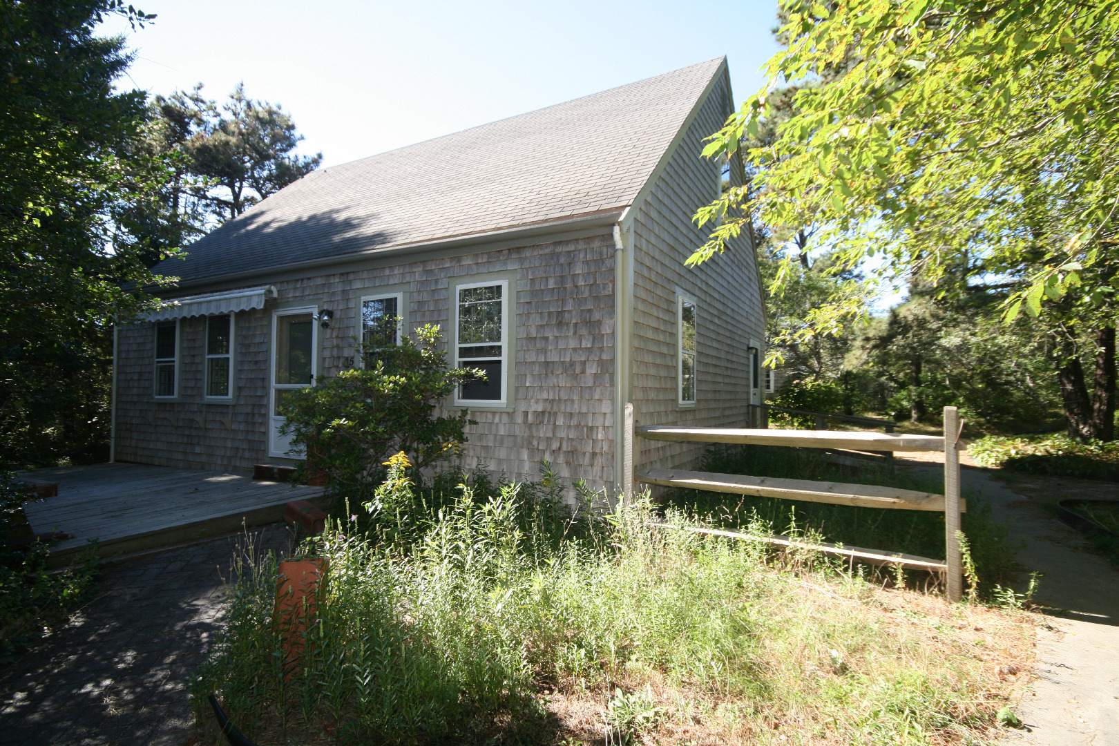 45 Fairgrounds Road Nantucket, MA 02554 - Photo 2 of 9 a house view with a garden space