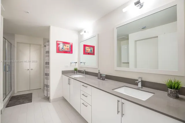 a spacious bathroom with a sink and a mirror