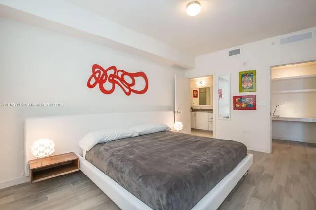 a bedroom with a bed and a couch