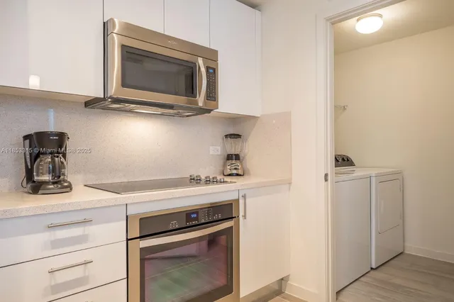 a kitchen with a stove and a microwave