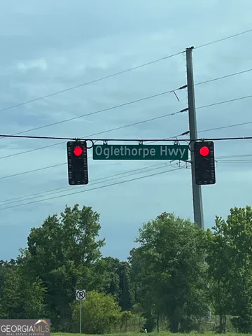 a street sign on a pole on a wall