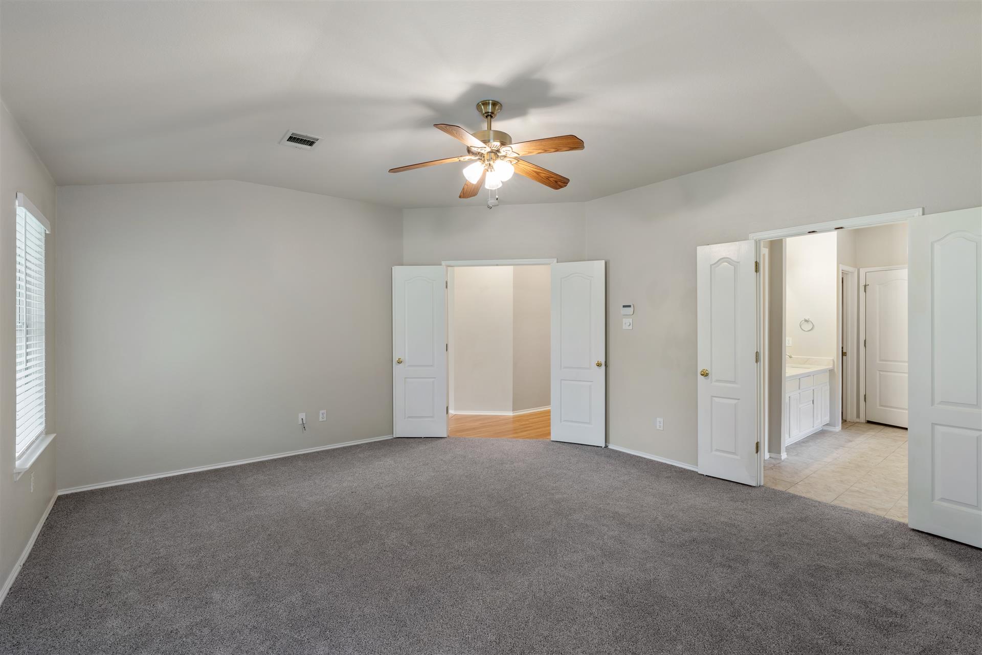 4725 Tello Path Austin, TX 78749 - Photo 19 of 34 An inviting primary bedroom with ample floor space and convenient access to a private bathroom.