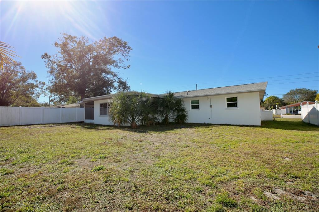 120 20th Street Southwest Largo, FL 33770 - Photo 13 of 46 a house with trees in front of it
