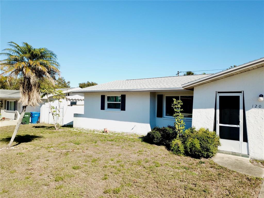120 20th Street Southwest Largo, FL 33770 - Photo 2 of 46 a front view of a house with a yard