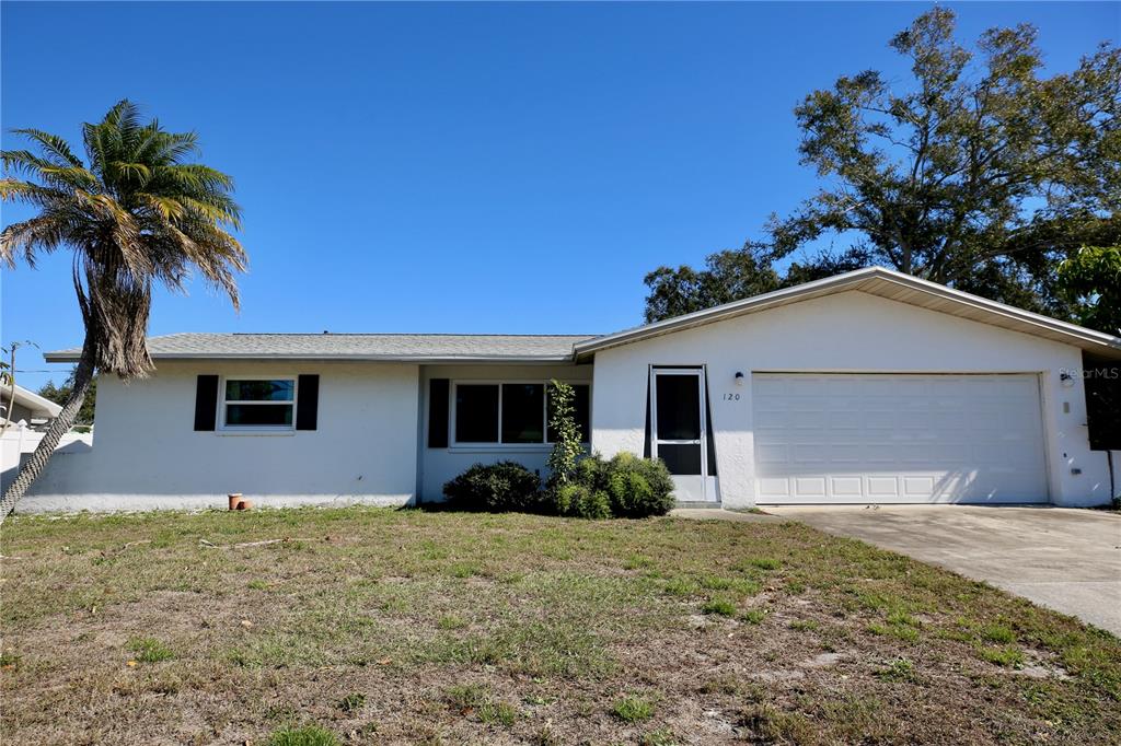 120 20th Street Southwest Largo, FL 33770 - Photo 21 of 46 a front view of house with yard and trees around