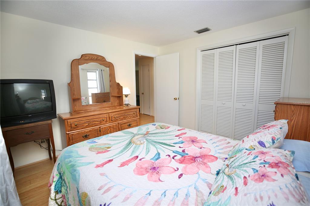 120 20th Street Southwest Largo, FL 33770 - Photo 24 of 46 a bedroom with a bed and a flat screen tv
