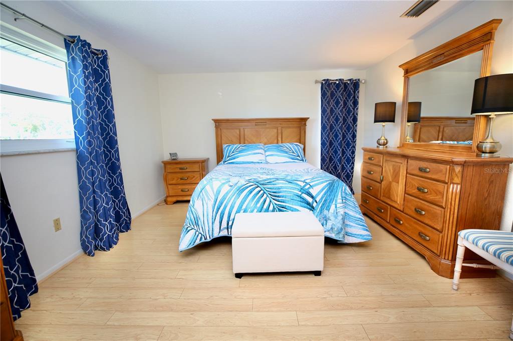 120 20th Street Southwest Largo, FL 33770 - Photo 26 of 46 a bedroom with a bed and a tv
