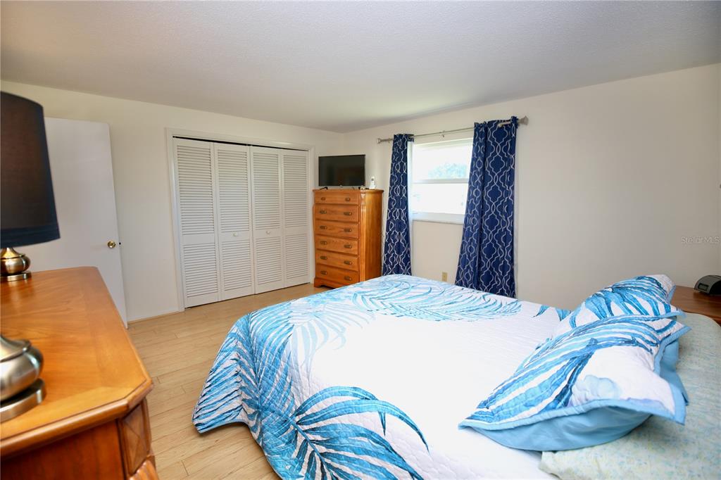 120 20th Street Southwest Largo, FL 33770 - Photo 27 of 46 a bedroom with a bed and a couch